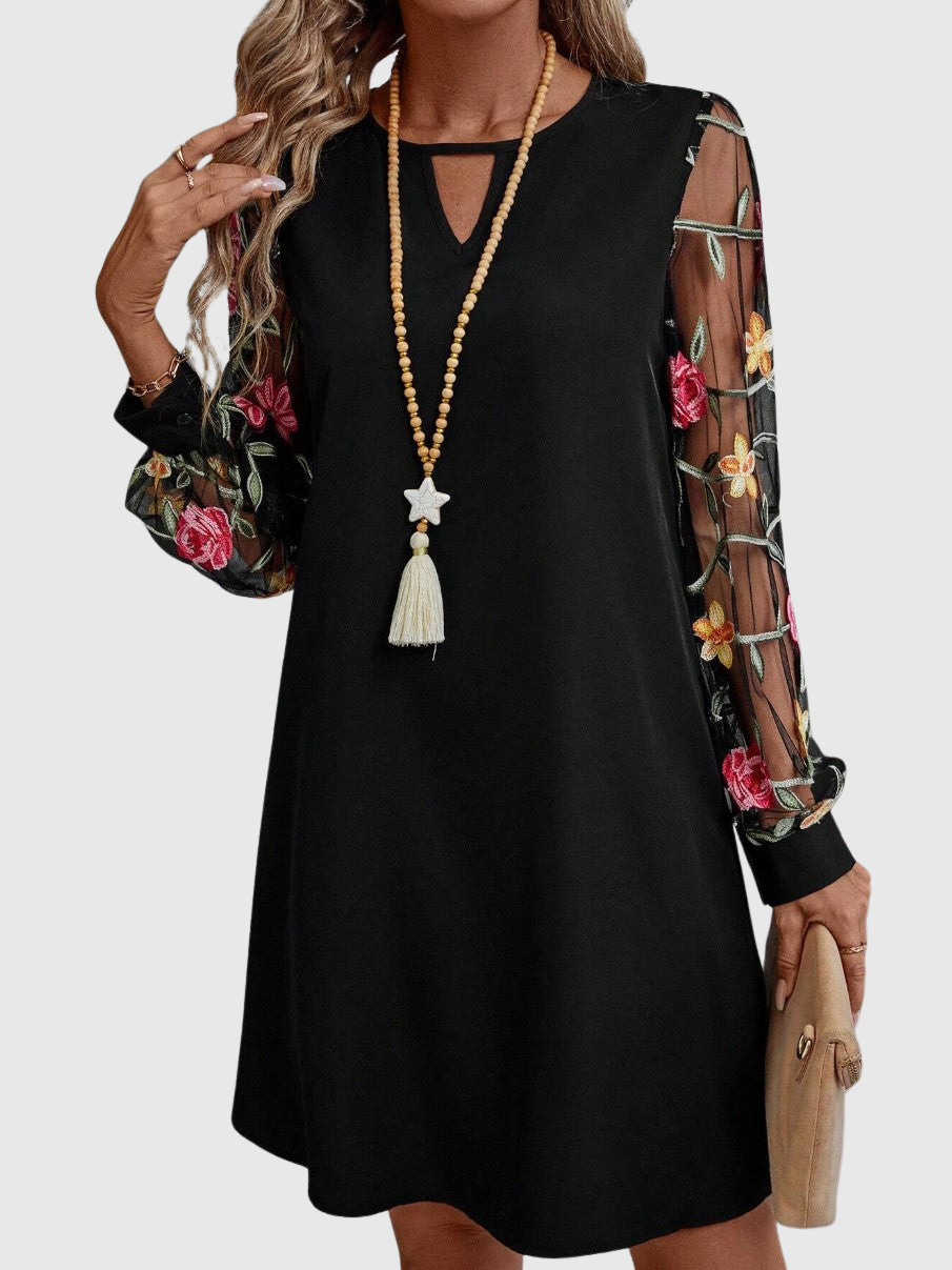 Jolanta | Elegancka sukienka z dekoltem w kształcie V i wyrazistymi rękawami