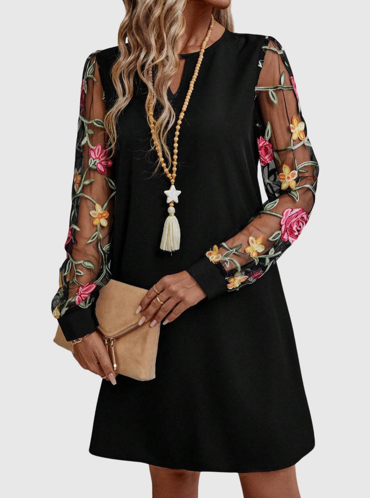 Jolanta | Elegancka sukienka z dekoltem w kształcie V i wyrazistymi rękawami